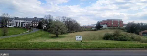 a view of a garden with a house