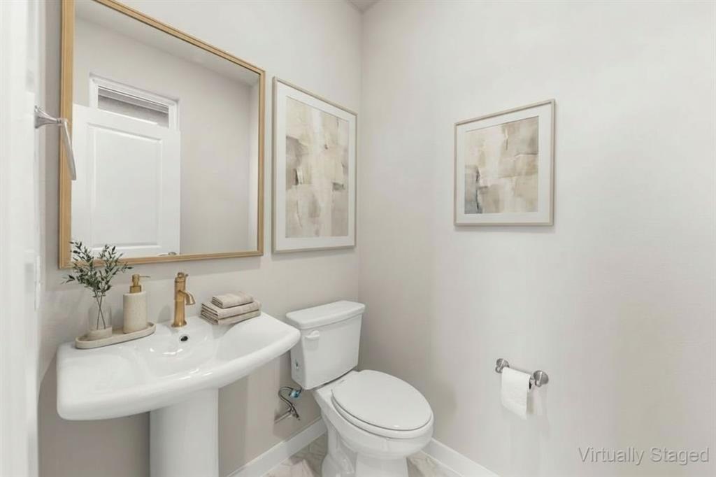 2013 Aldrich Road Celina, TX 75009 - Photo 20 of 40 a bathroom with a toilet sink and mirror