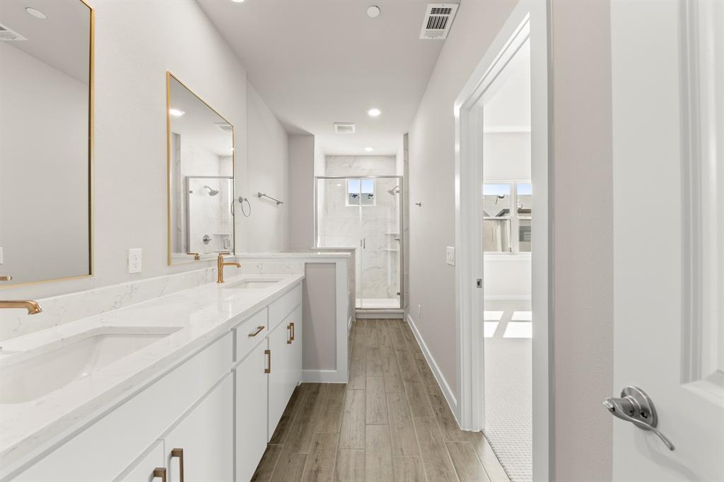 2013 Aldrich Road Celina, TX 75009 - Photo 34 of 40 a spacious bathroom with a double vanity sink a mirror and a shower