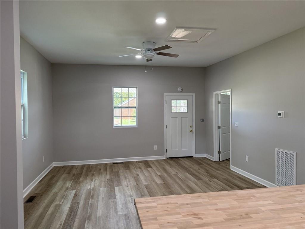 1300 Murphy Avenue LaGrange, GA 30240 - Photo 11 of 24 an empty room with wooden floor and windows