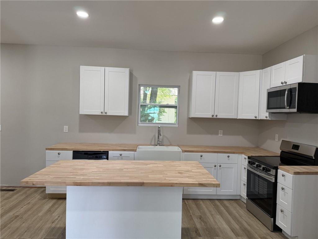 1300 Murphy Avenue LaGrange, GA 30240 - Photo 12 of 24 a kitchen with a sink a stove and cabinets