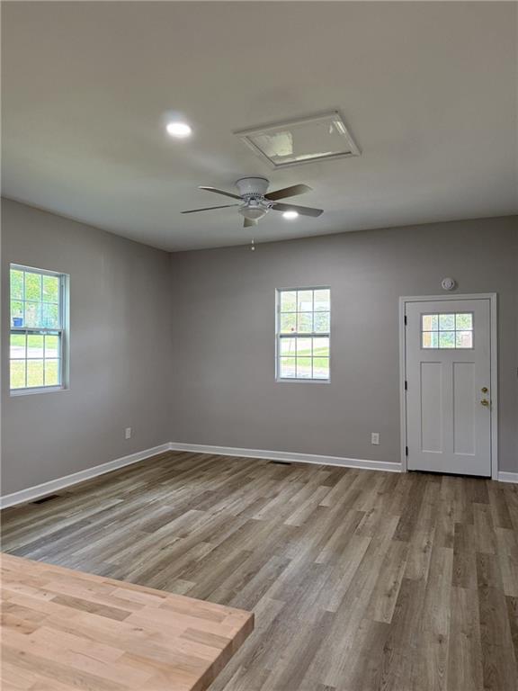 1300 Murphy Avenue LaGrange, GA 30240 - Photo 16 of 24 an empty room with wooden floor and windows