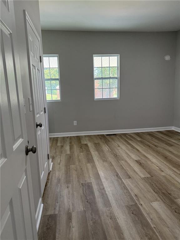 1300 Murphy Avenue LaGrange, GA 30240 - Photo 21 of 24 an empty room with wooden floor and windows