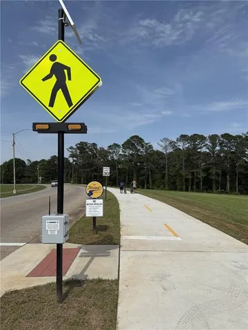 a view of swimming pool with a yard