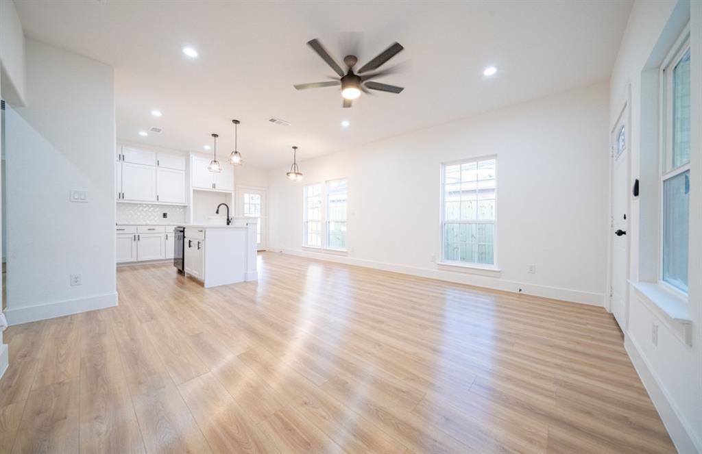 3411 Ladd Street Dallas, TX 75212 - Photo 3 of 14 a view of empty room with wooden floor and window