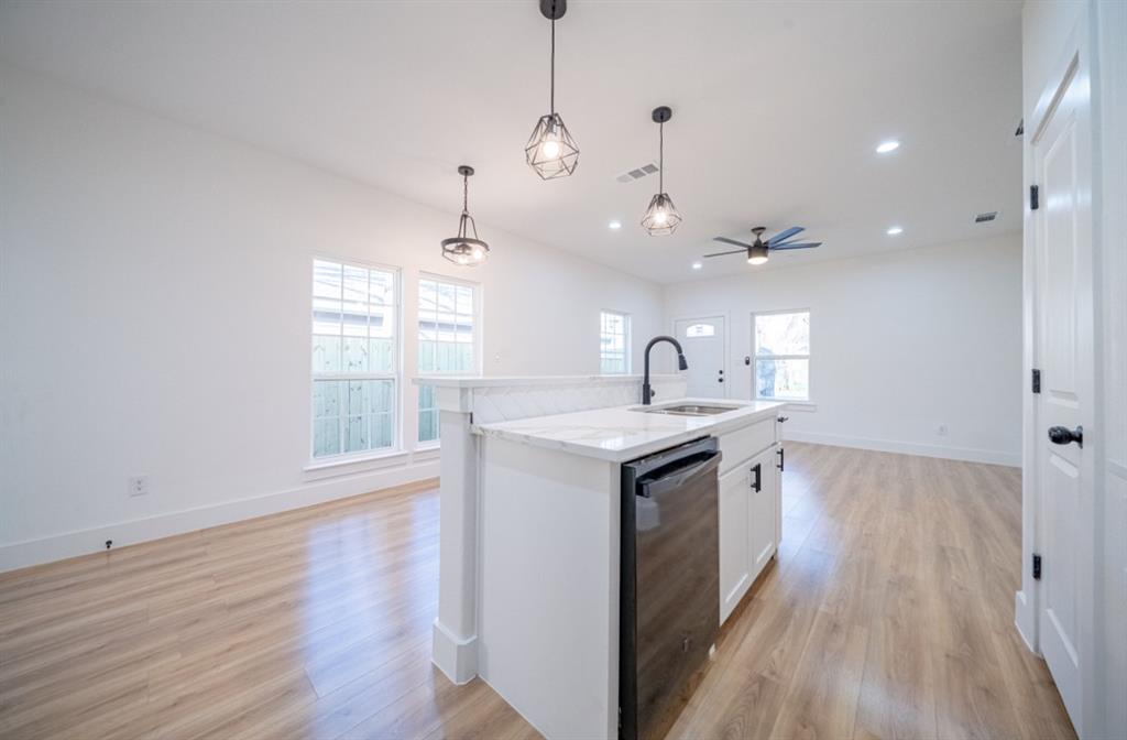 3411 Ladd Street Dallas, TX 75212 - Photo 14 of 14 a kitchen with a sink and wooden floor