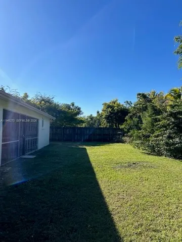 a view of a backyard with green space