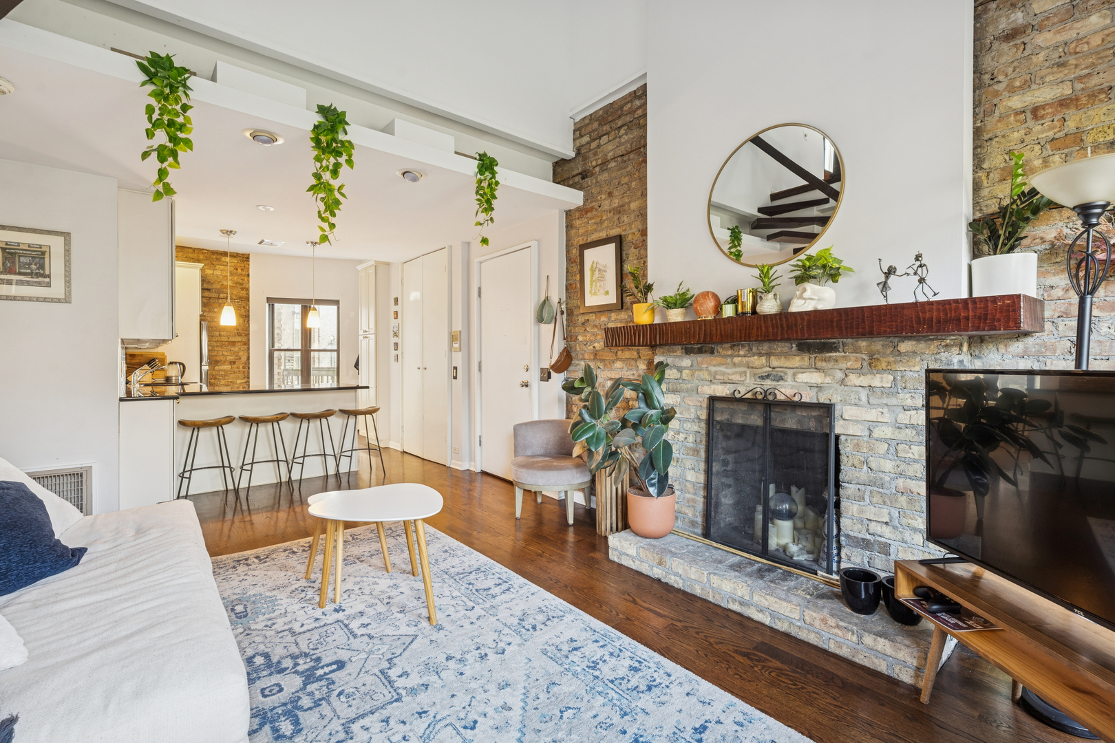 815 West Cuyler Avenue, Unit 3 Chicago, IL 60613 - Photo 4 of 16 a living room with furniture and a fireplace