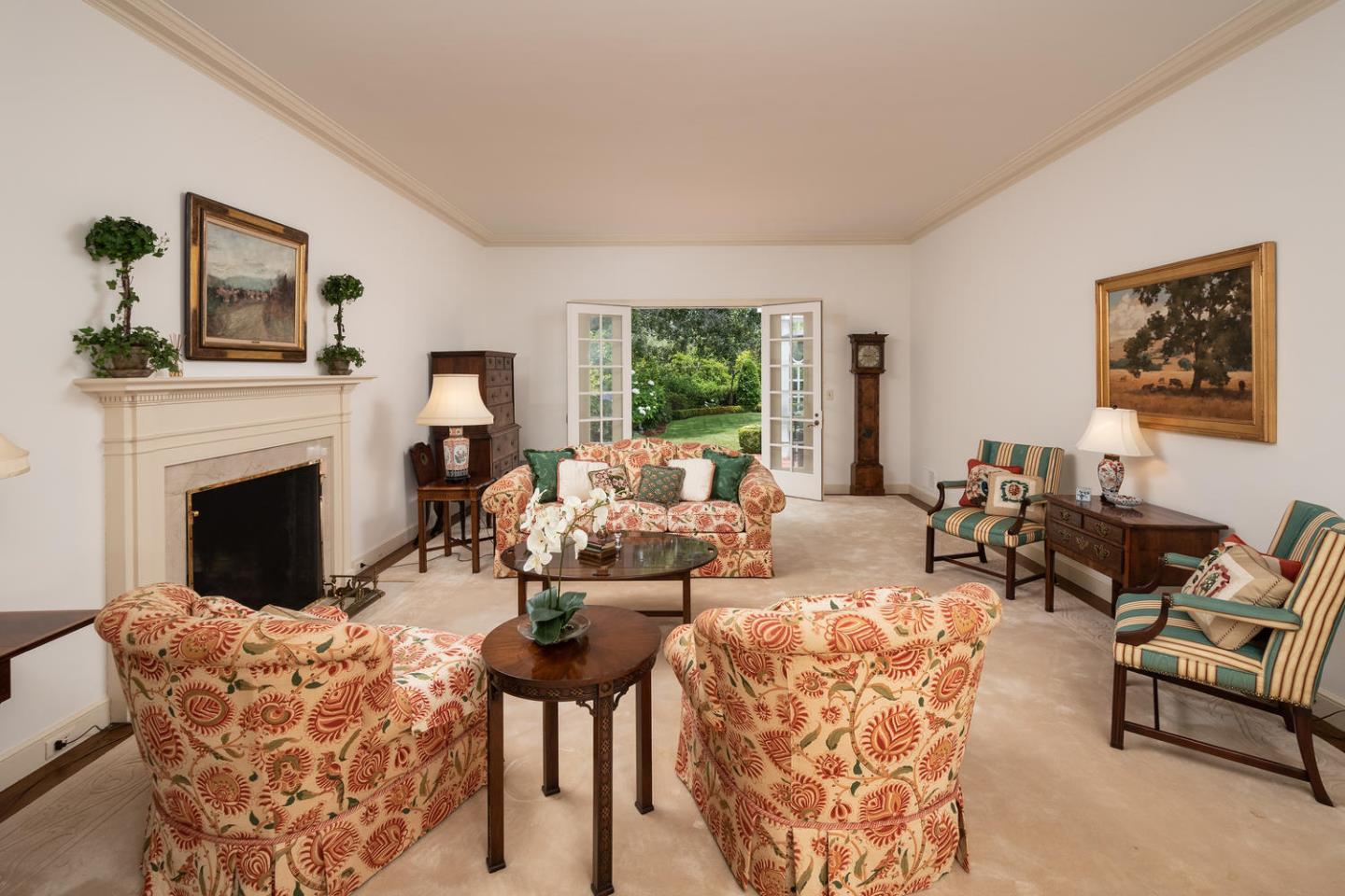 720 Eucalyptus Avenue Hillsborough, CA 94010 - Photo 11 of 48 a living room with furniture fireplace and window