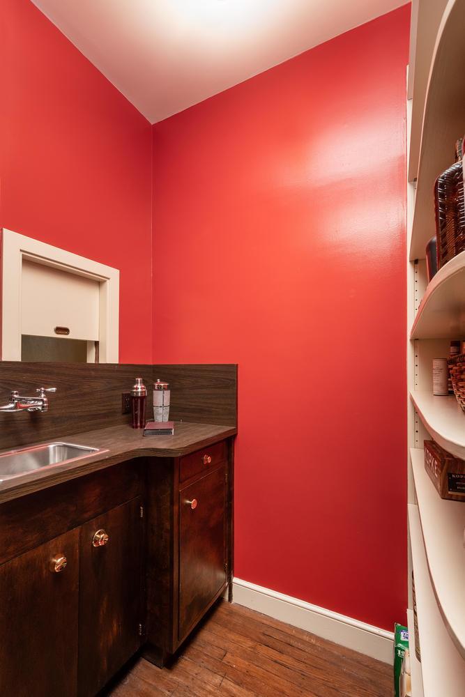 720 Eucalyptus Avenue Hillsborough, CA 94010 - Photo 15 of 48 a kitchen with a sink cabinets and a wooden floor