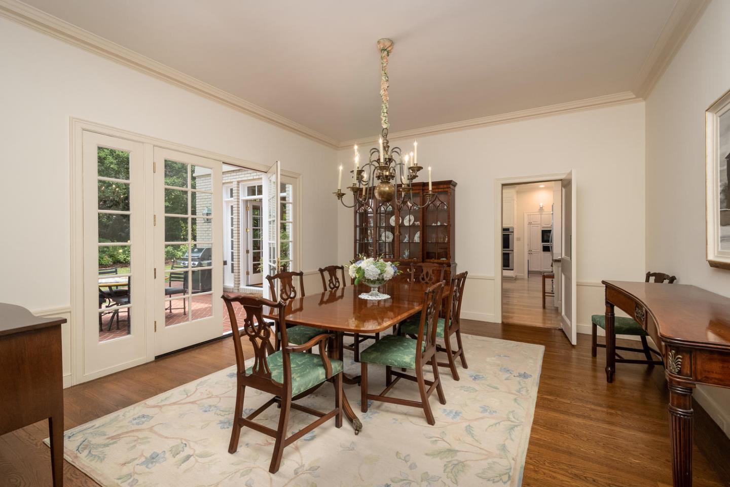 720 Eucalyptus Avenue Hillsborough, CA 94010 - Photo 16 of 48 a dining room with furniture window and wooden floor