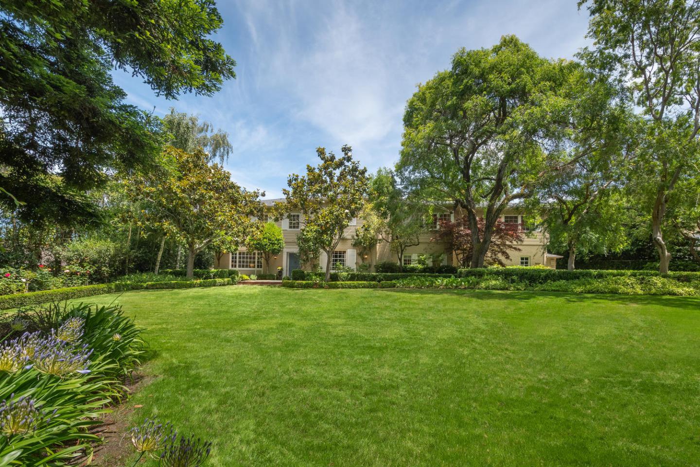 720 Eucalyptus Avenue Hillsborough, CA 94010 - Photo 2 of 48 a big yard with lots of green space and trees