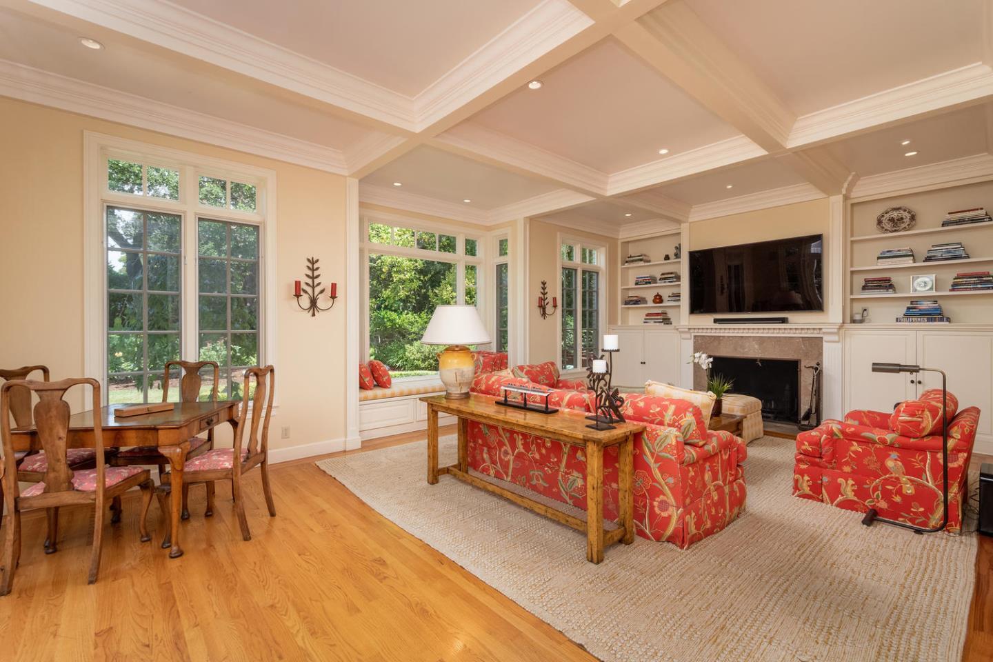 720 Eucalyptus Avenue Hillsborough, CA 94010 - Photo 21 of 48 a living room with fireplace furniture and a flat screen tv