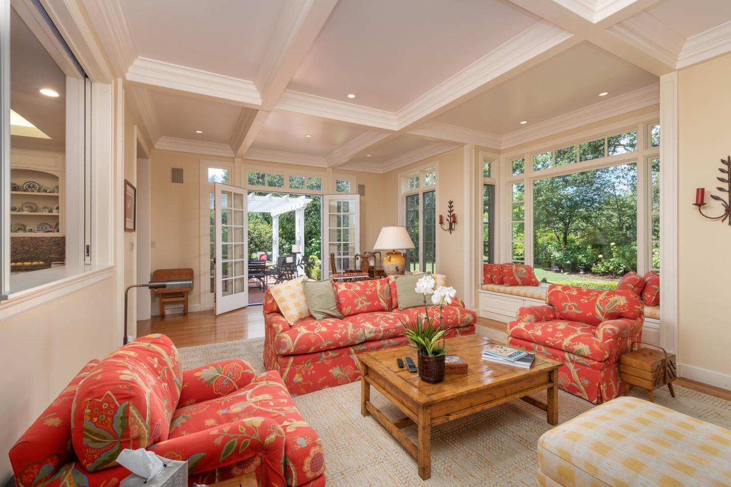 720 Eucalyptus Avenue Hillsborough, CA 94010 - Photo 22 of 48 a living room with patio furniture and a large window