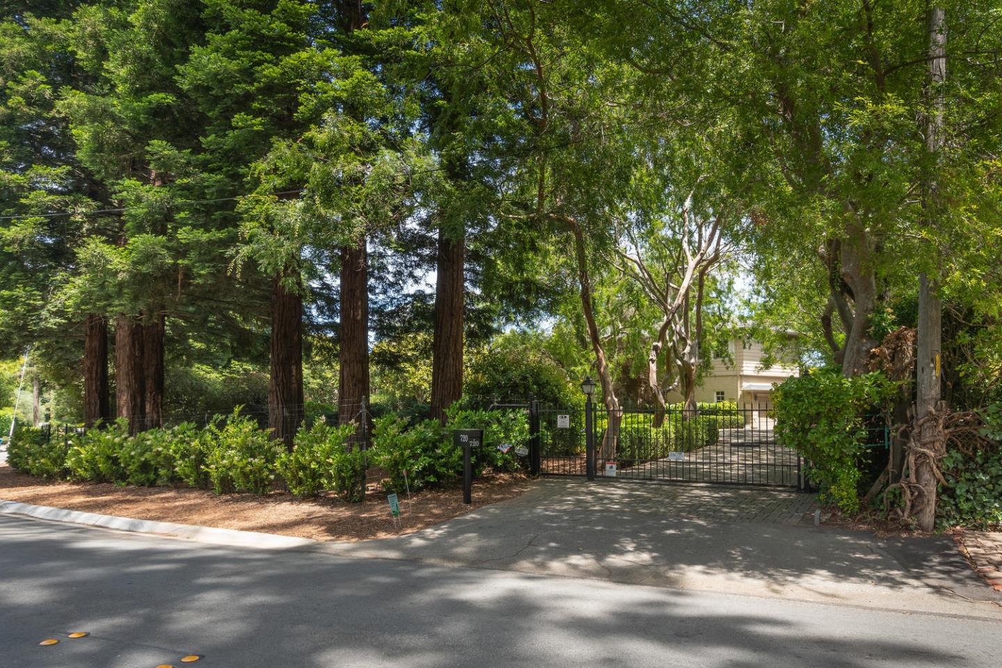 720 Eucalyptus Avenue Hillsborough, CA 94010 - Photo 3 of 48 a view of a street with trees in the background