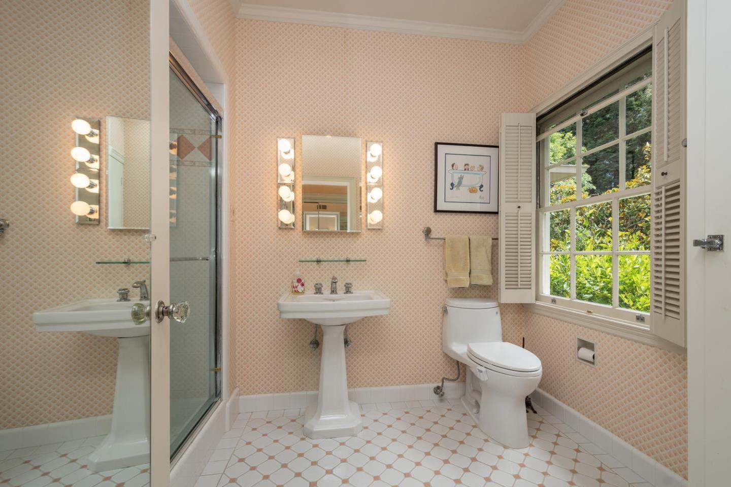 720 Eucalyptus Avenue Hillsborough, CA 94010 - Photo 33 of 48 a bathroom with a toilet sink and a shower