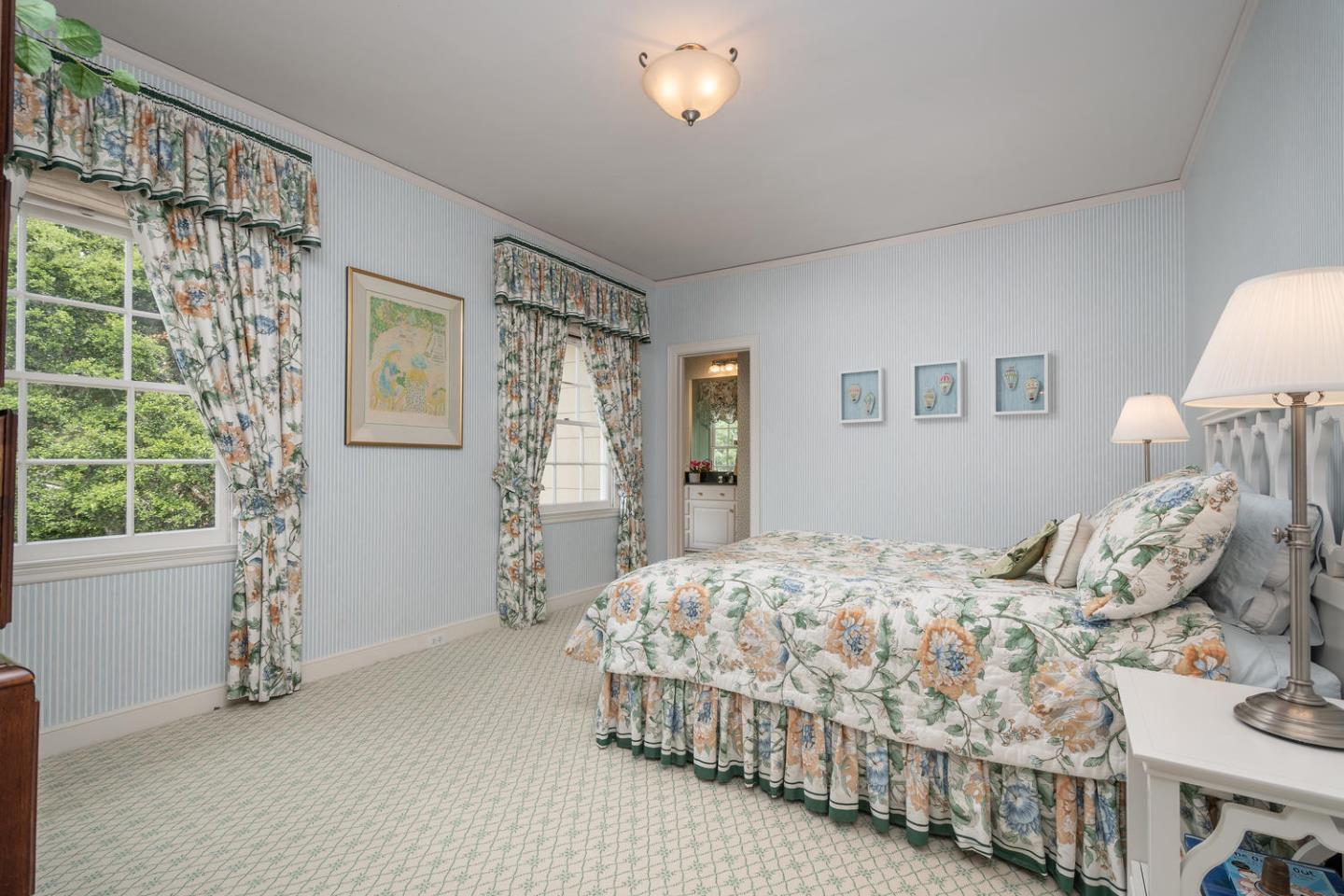 720 Eucalyptus Avenue Hillsborough, CA 94010 - Photo 34 of 48 a bedroom with a bed and a window