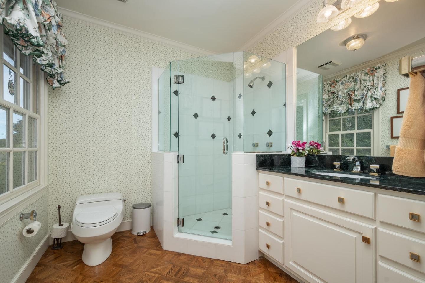 720 Eucalyptus Avenue Hillsborough, CA 94010 - Photo 35 of 48 a bathroom with a sink toilet and shower