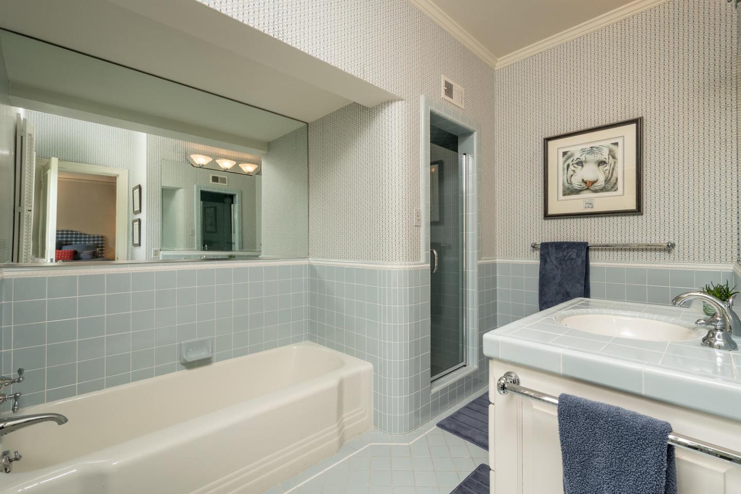 720 Eucalyptus Avenue Hillsborough, CA 94010 - Photo 37 of 48 a bathroom with a bathtub and a sink