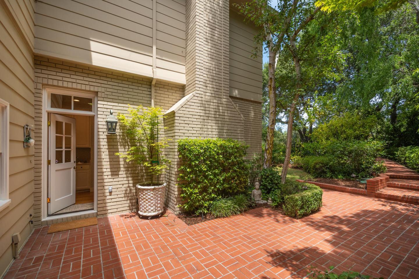 720 Eucalyptus Avenue Hillsborough, CA 94010 - Photo 46 of 48 a view of a balcony with chairs and potted plants