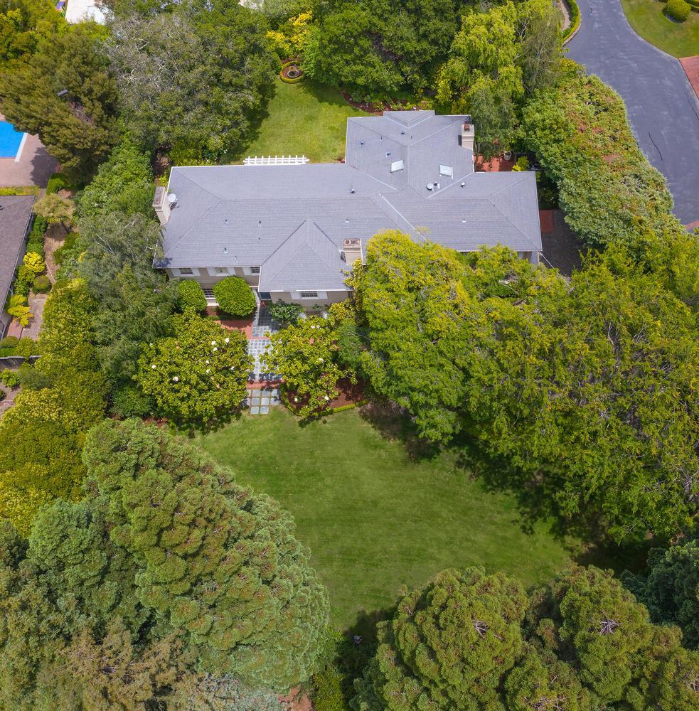 720 Eucalyptus Avenue Hillsborough, CA 94010 - Photo 48 of 48 an aerial view of a house with a yard and garden