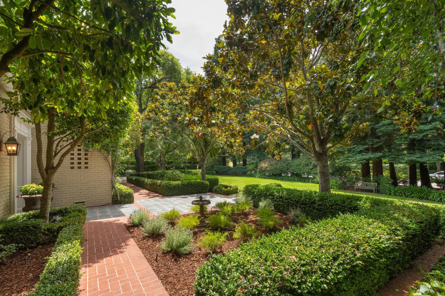 720 Eucalyptus Avenue Hillsborough, CA 94010 - Photo 8 of 48 a view of backyard with green space