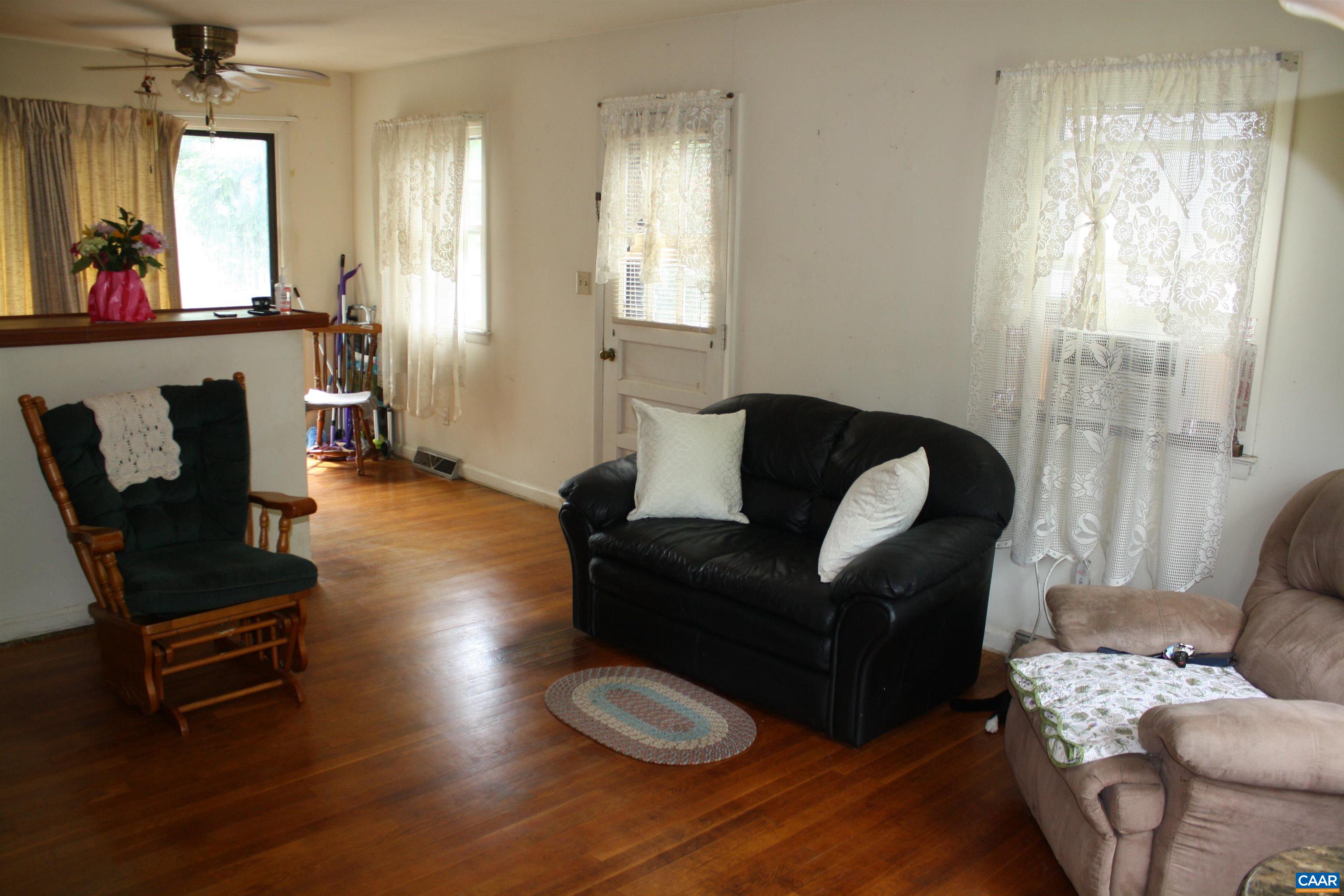 1641 Meridian Street Charlottesville, VA 22902 - Photo 2 of 21 a living room with furniture and a large window