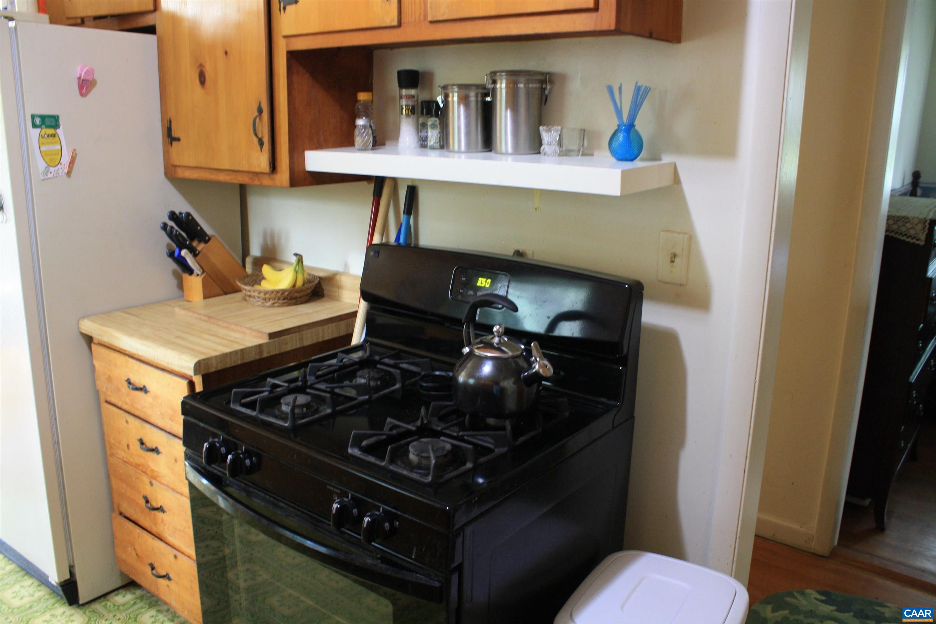 1641 Meridian Street Charlottesville, VA 22902 - Photo 4 of 21 a kitchen with a stove and a cabinet