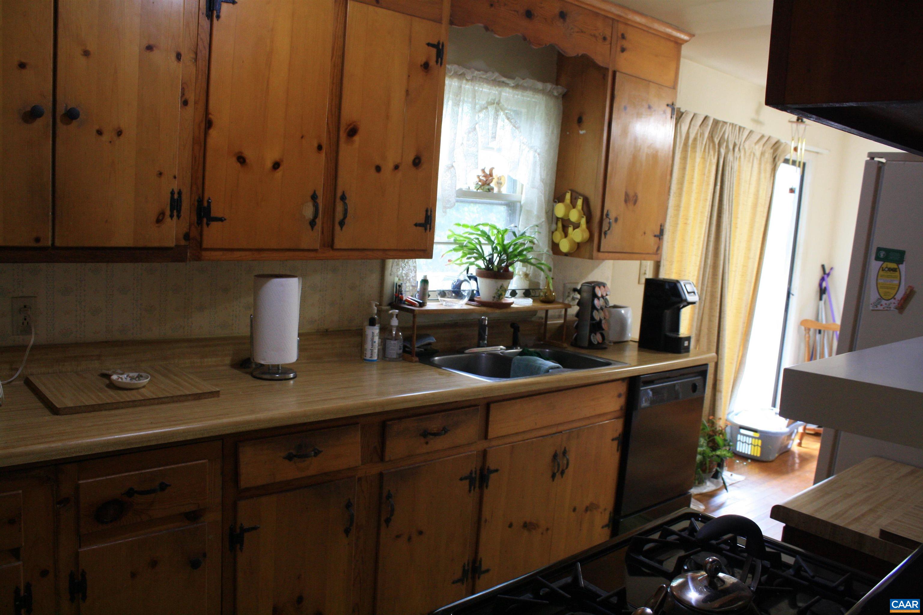 1641 Meridian Street Charlottesville, VA 22902 - Photo 5 of 21 a kitchen with a sink and cabinets