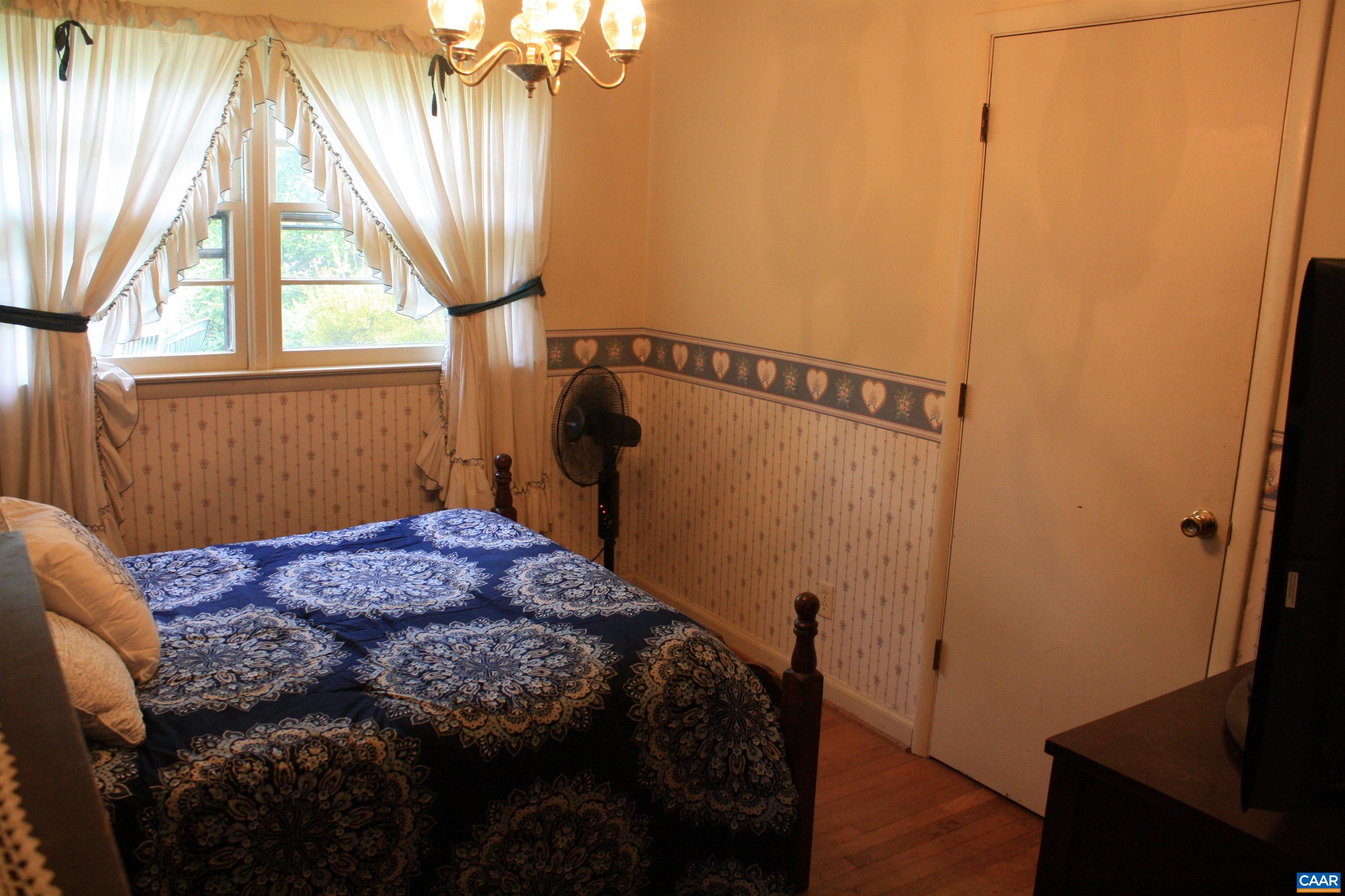 1641 Meridian Street Charlottesville, VA 22902 - Photo 6 of 21 a bedroom with a bed and a window