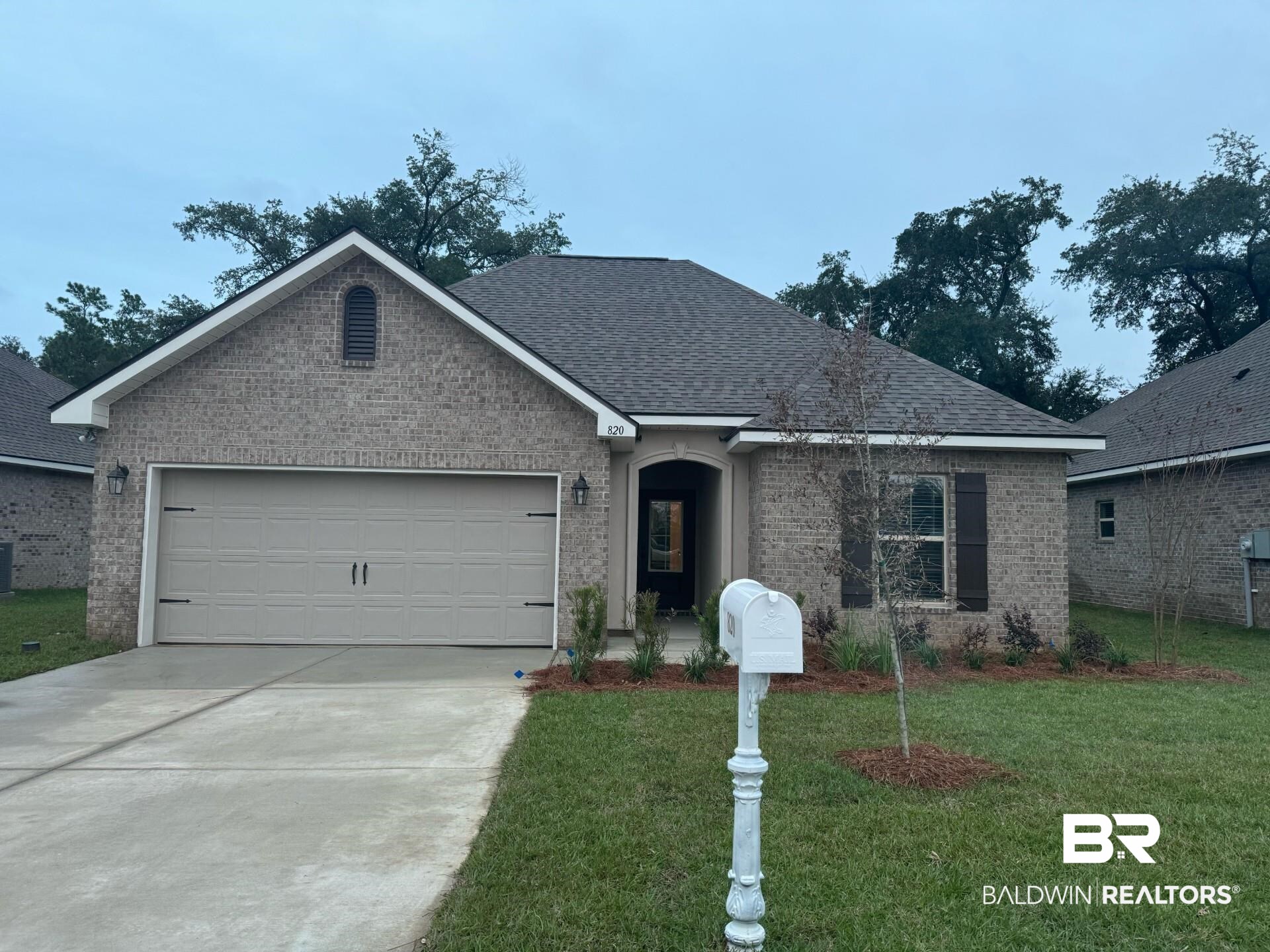 820 Sumter Loop Foley, AL 36535 - Photo 1 of 3 Ranch-style home featuring a garage and a front lawn