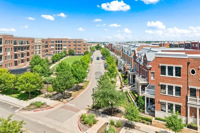 a kitchen with stainless steel appliances cabinets and a window