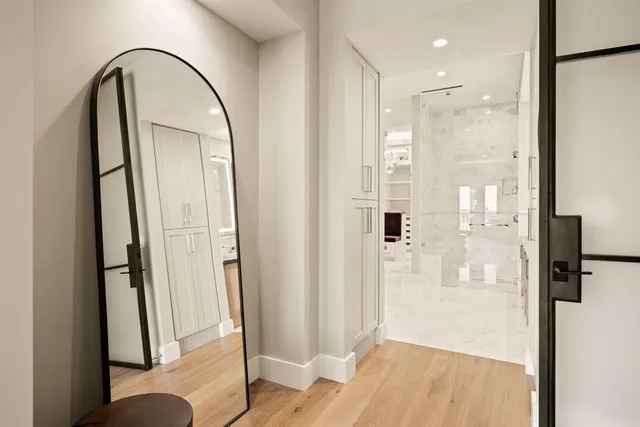 a bathroom with a bathtub and a shower