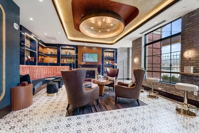 a living room with furniture and a large mirror