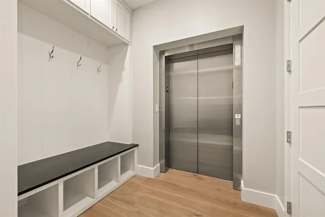 a view of kitchen with cabinets and wooden floor