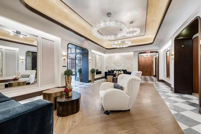 a bathroom with a glass door shower and a sink