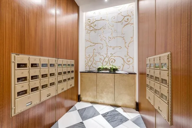 a kitchen with stainless steel appliances granite countertop a sink and a refrigerator