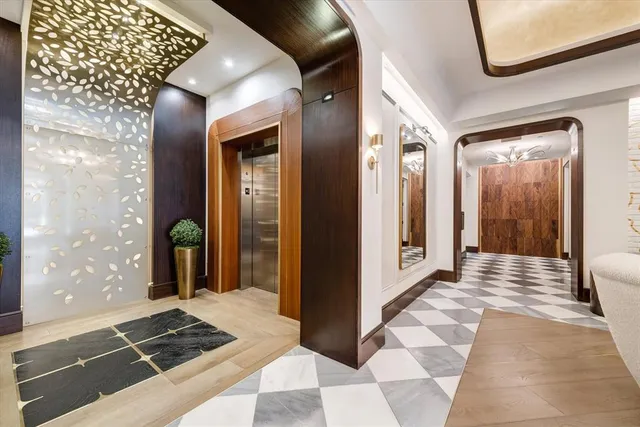 a large kitchen with a table and chairs