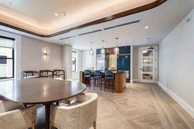 an aerial view of a building with a swimming pool