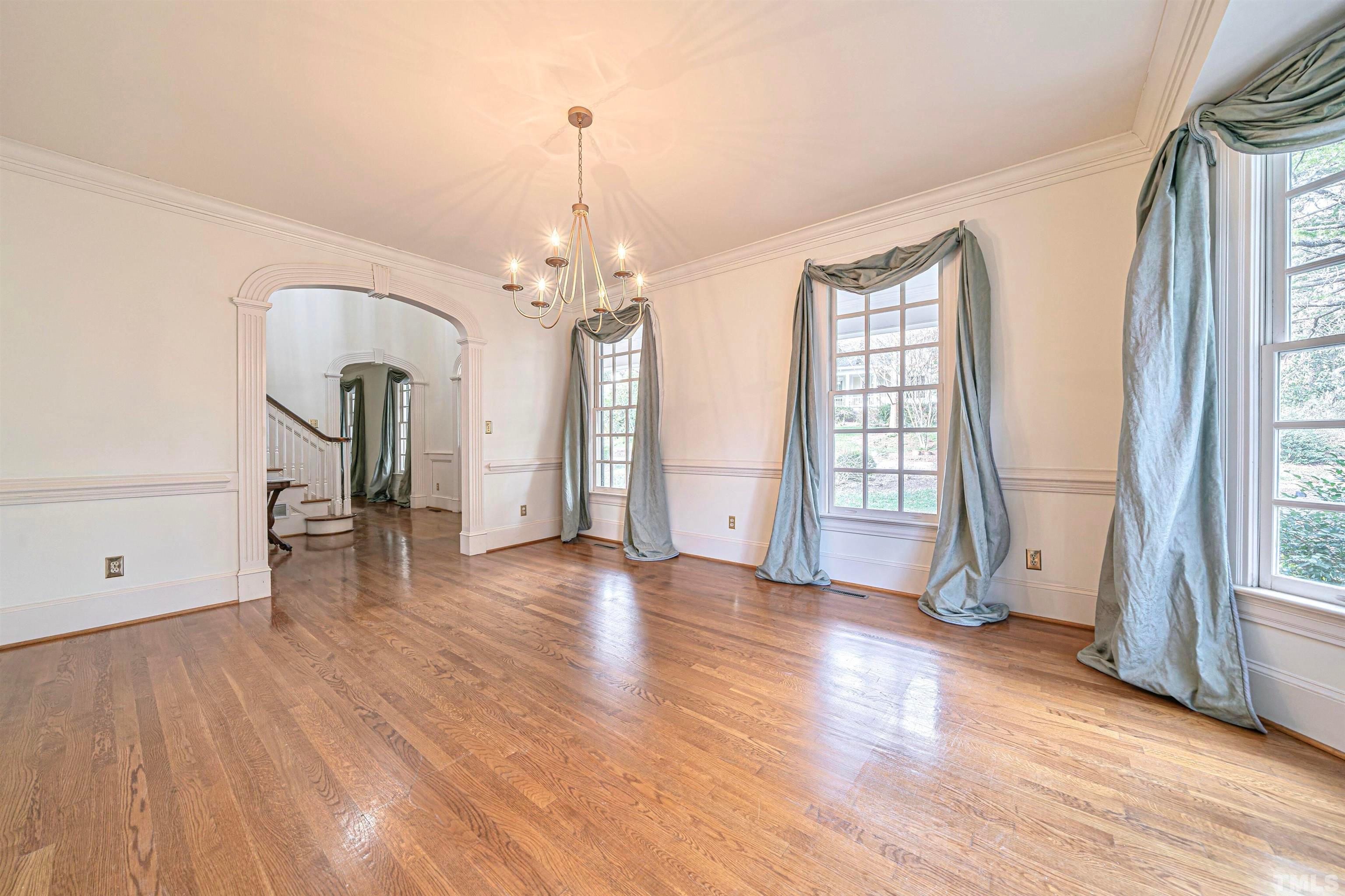 709 Runnymede Road Raleigh, NC 27607 - Photo 11 of 50 a view of empty room with wooden floor and fan