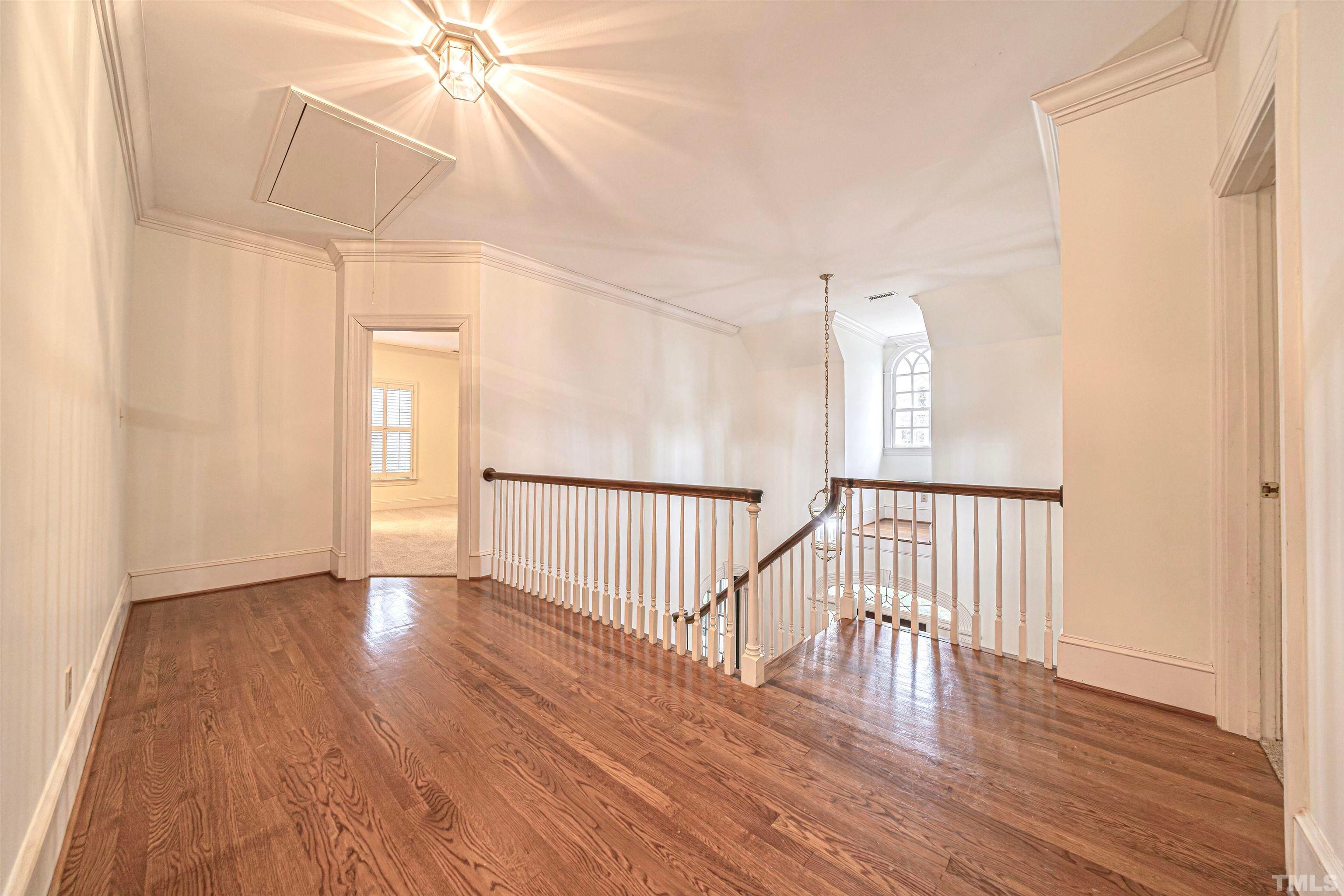 709 Runnymede Road Raleigh, NC 27607 - Photo 32 of 50 a view of a room with wooden floor fan and windows