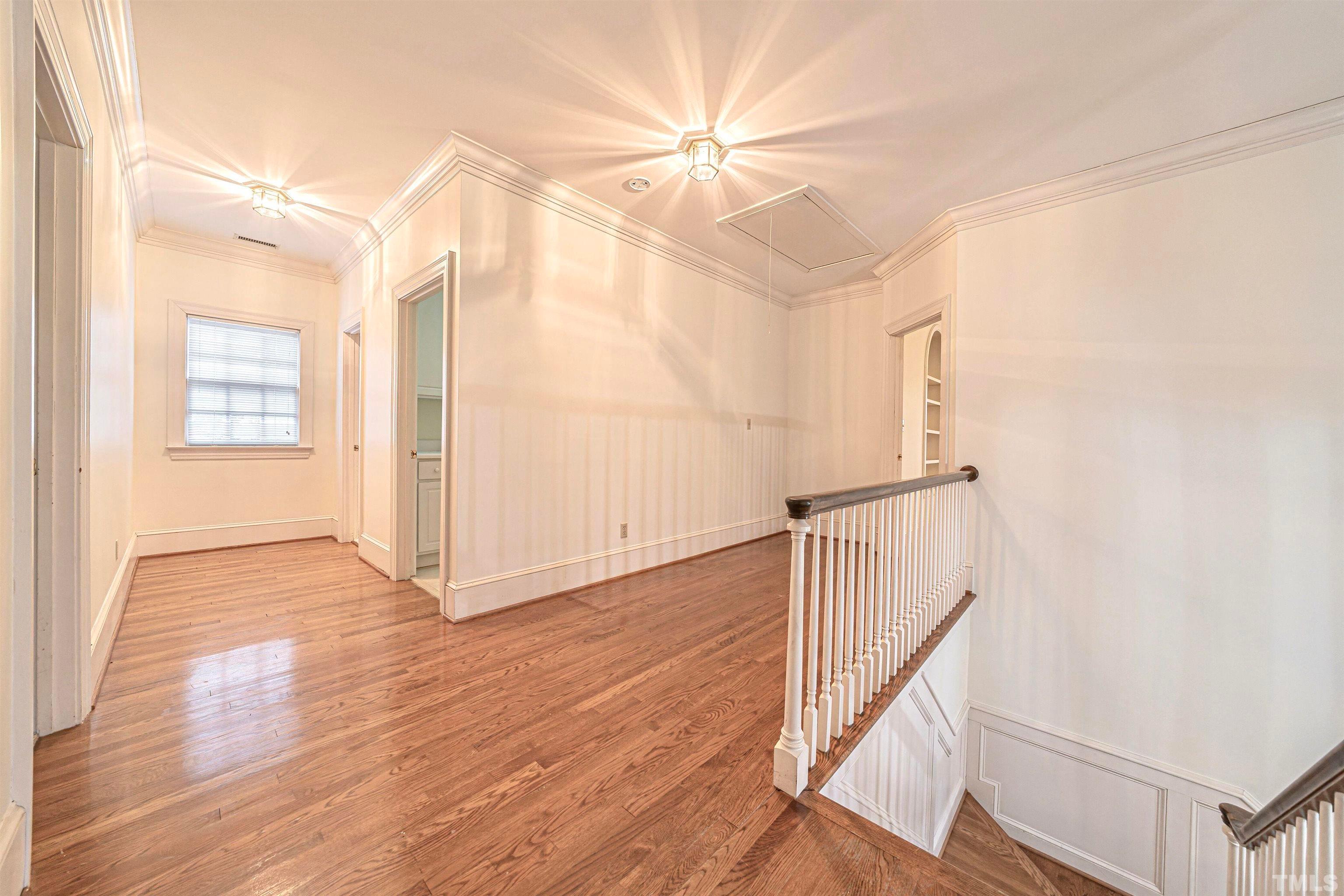709 Runnymede Road Raleigh, NC 27607 - Photo 33 of 50 a view of an entryway with wooden floor