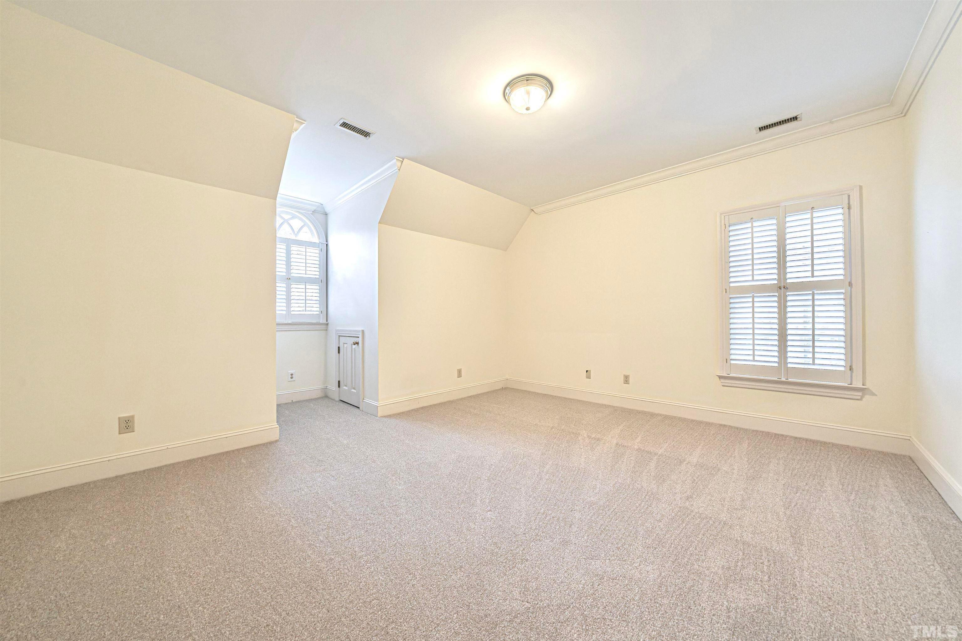 709 Runnymede Road Raleigh, NC 27607 - Photo 41 of 50 an empty room with windows