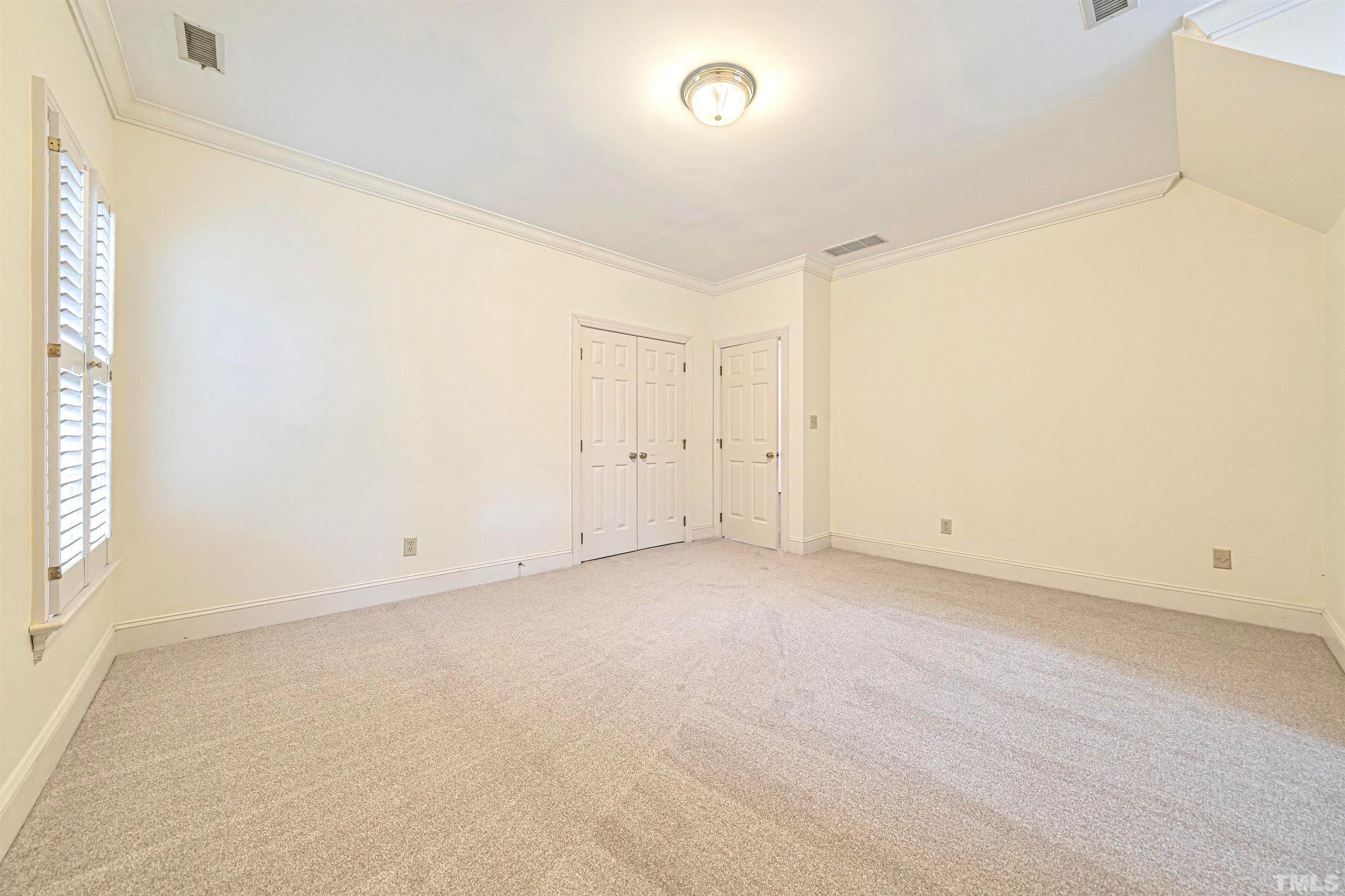 709 Runnymede Road Raleigh, NC 27607 - Photo 42 of 50 an empty room with a natural light