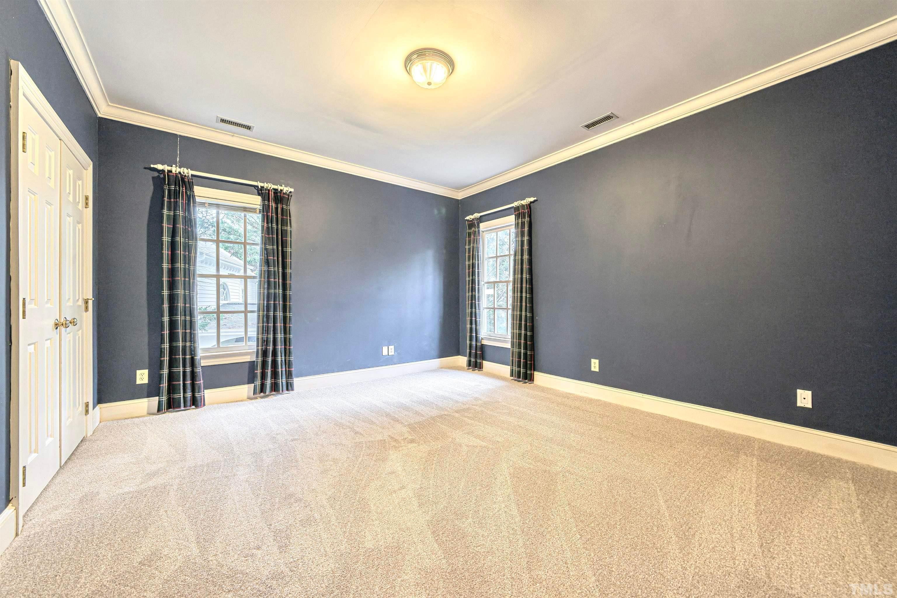 709 Runnymede Road Raleigh, NC 27607 - Photo 43 of 50 a bedroom with a bed and window