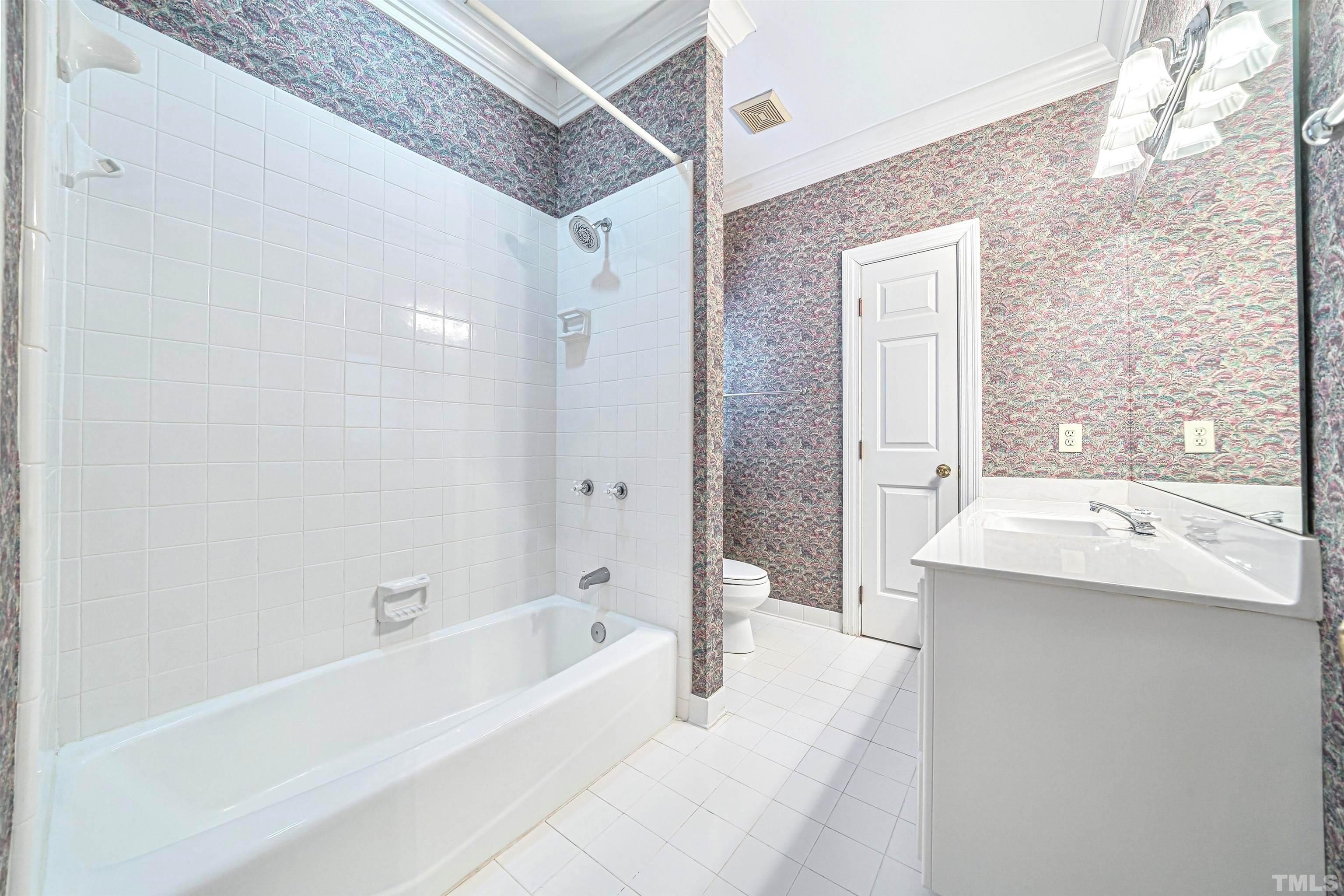 709 Runnymede Road Raleigh, NC 27607 - Photo 44 of 50 a bathroom with a bathtub and a sink