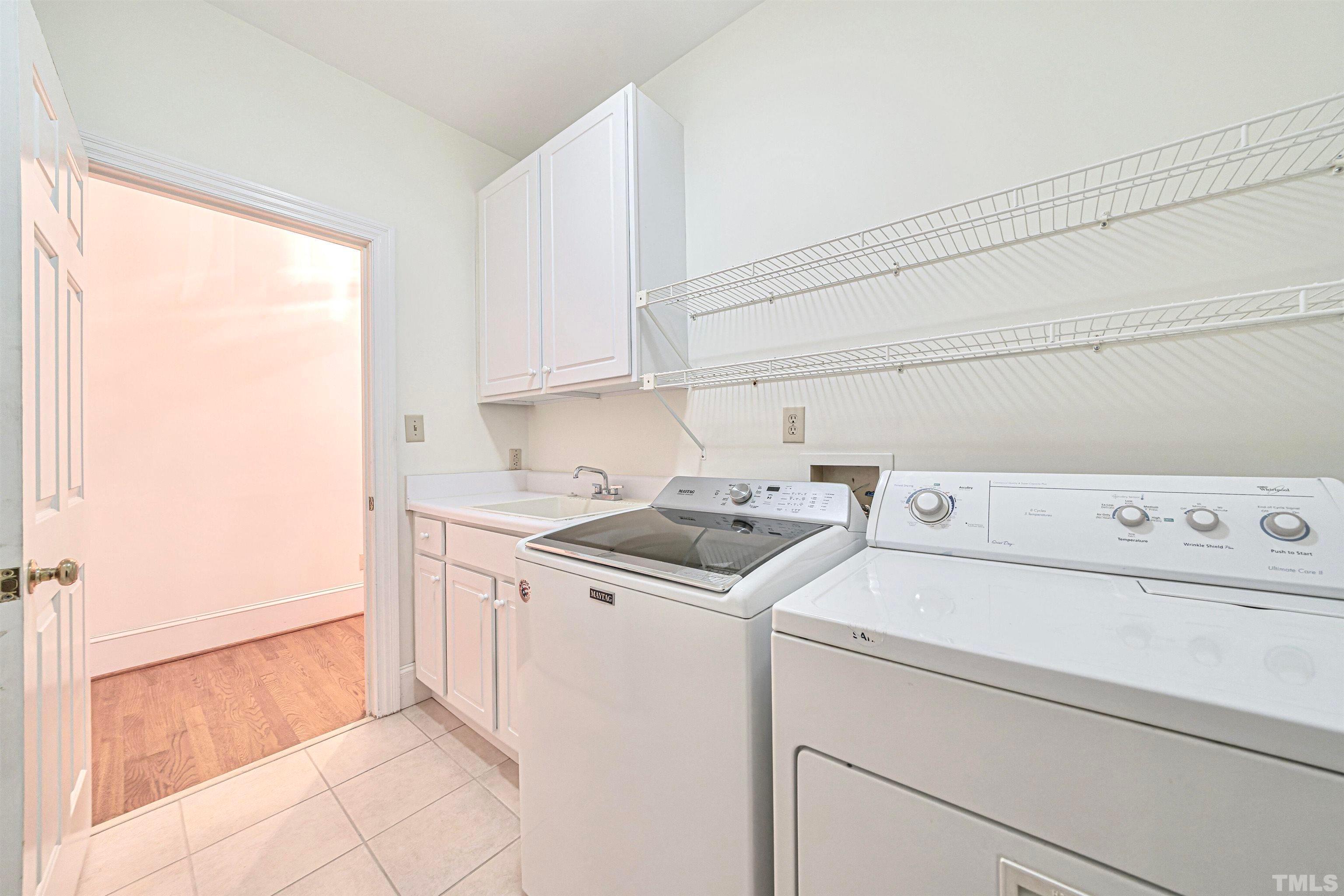 709 Runnymede Road Raleigh, NC 27607 - Photo 45 of 50 a utility room with dryer and washer