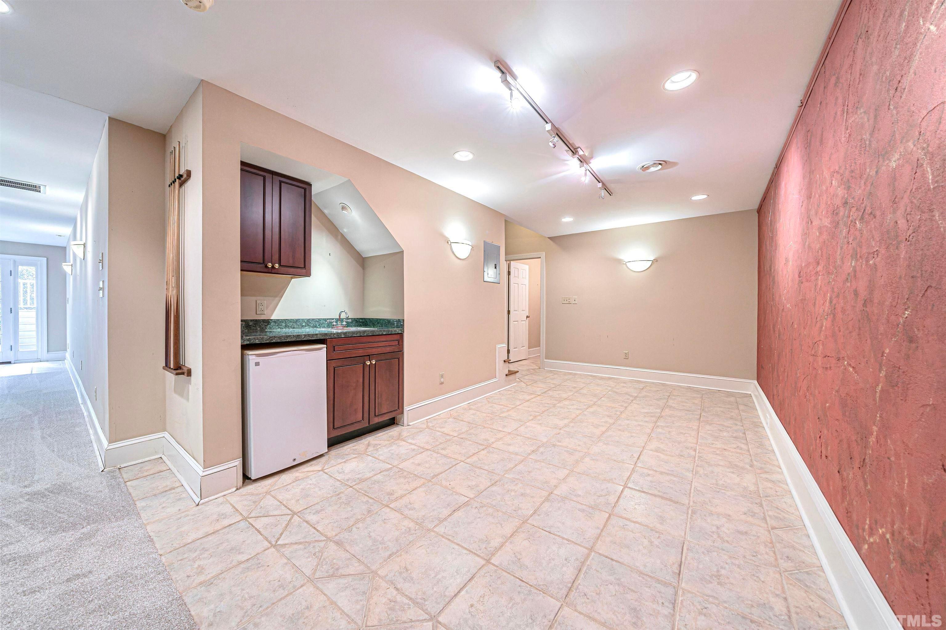 709 Runnymede Road Raleigh, NC 27607 - Photo 48 of 50 a bathroom with a granite countertop sink a mirror and a vanity