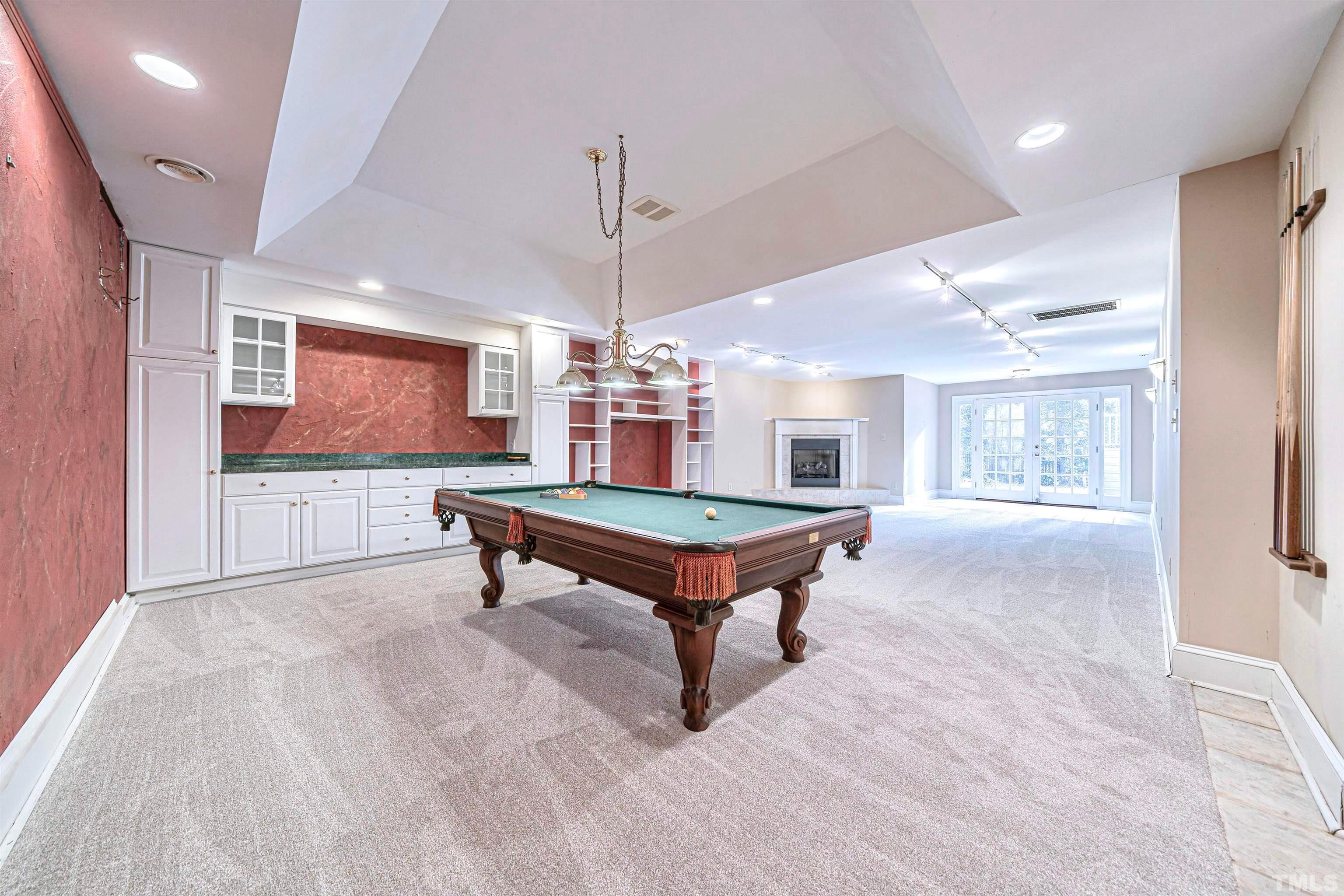 709 Runnymede Road Raleigh, NC 27607 - Photo 49 of 50 a room with pool table and windows