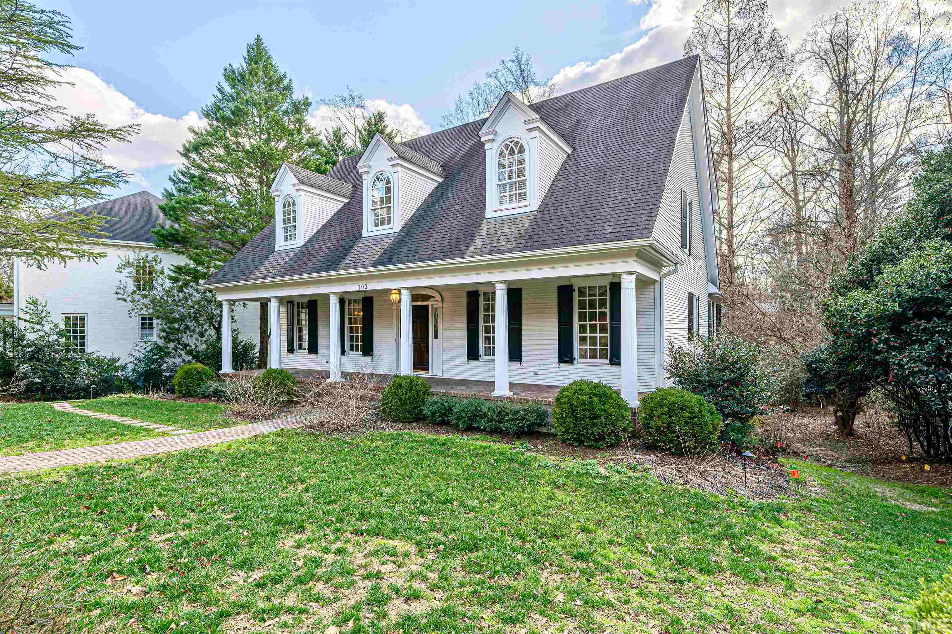 709 Runnymede Road Raleigh, NC 27607 - Photo 5 of 50 a view of a house with garden and yard